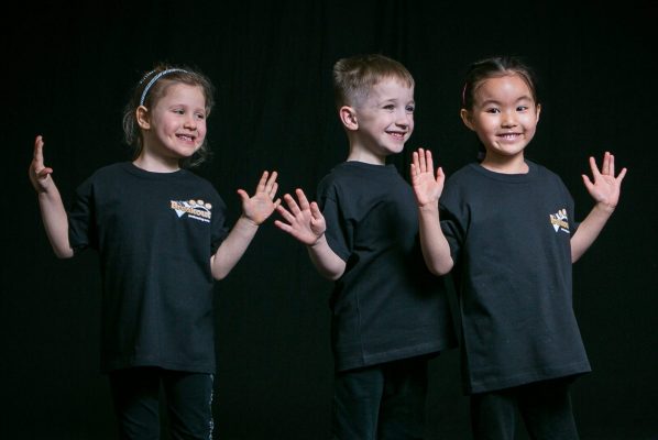 This image shows some 3-5 year olds from our Infant Class singing, dancing and acting in our performing arts classes.