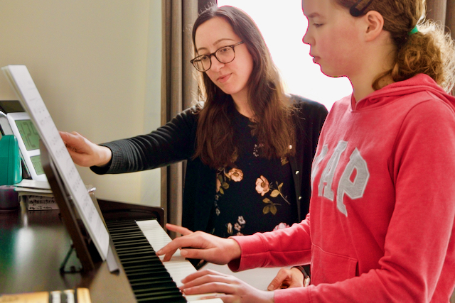 We teach piano lessons privately. This image shows one of our students having their lesson with Rachel (one of the Principals of our school).